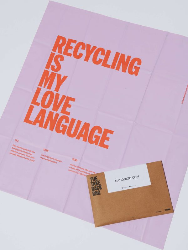 Pink clothing recycling bag that says 'Recycling is my love language' in orange text.